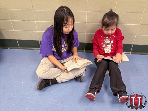 Students sitting on the floor together