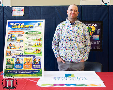 Gentleman posing with career day poster
