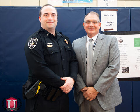 Police officer posing with a judge