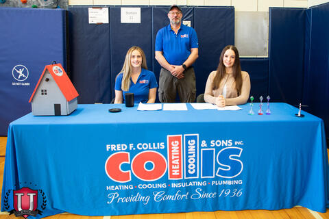 Collis and sons staff posing with their career table