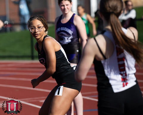 Athletes getting ready for baton hand off
