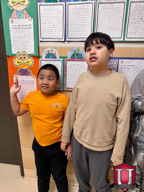 Students smiling awkwardly