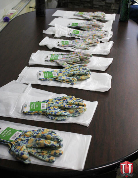 Gloves and trashbags lined up ready to be picked up by students