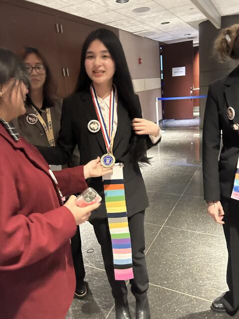 A close up image of a medal won during the event