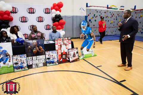 Dr Spence talking to mike and his table
