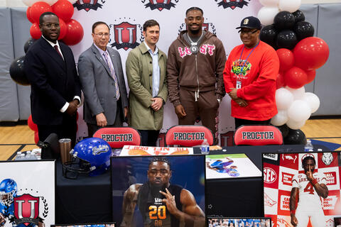 Mike posing with some administrative staff