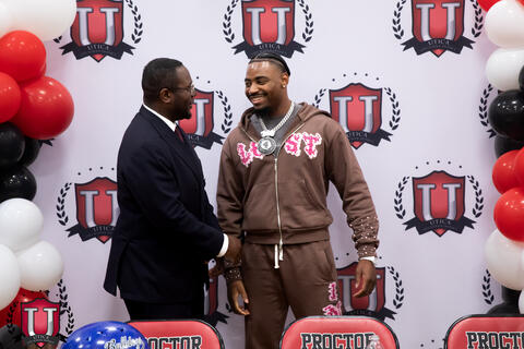 Dr spence and mike shaking hands