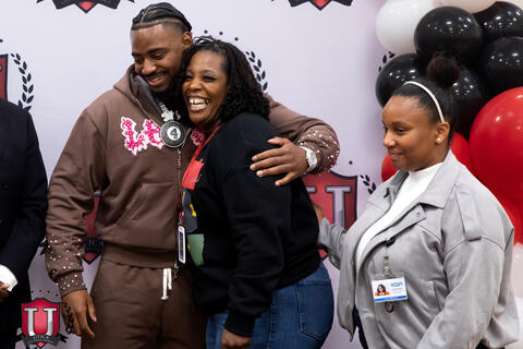 Mike hugging a staff member