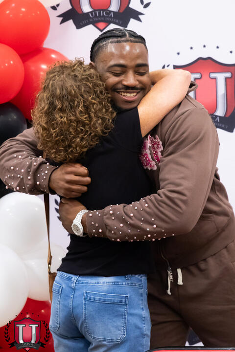 Mike hugging a staff member