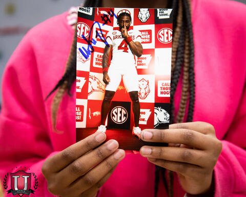 Close up shot of a card with Mike on it, that was signed