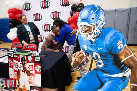 Mike hugging a staff member