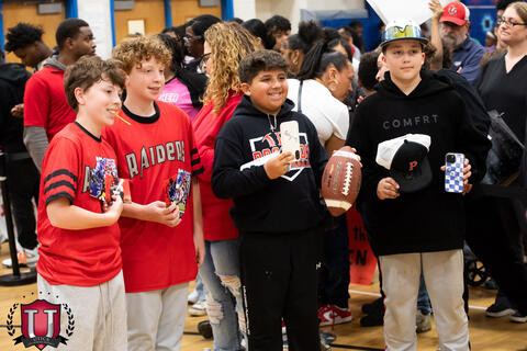 Students posing together with their gear