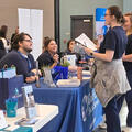 Student at a Health Career Fair booth.
