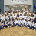 Group photo of Fletcher Technical Community College's Summer 2026 Associate of Science in Nursing graduates and faculty. The 52-student cohort, representing the traditional ASN and LPN-to-RN Bridge pathways, is the largest ASN graduating class in the coll