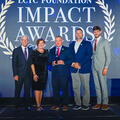 Joe May, Dr. Kristine Strickland, Charlie Burt, Garret Landry and Richard Nelson stand onstage at the LCTC Foundation Impact Awards. Burt holds the Joe D. May Excellence in Public Policy Award.