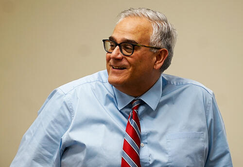 Mark Spinola smiles while instructing students