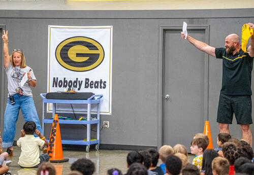 Brett Kiesel and Dr. Jennifer Hoffner lead University Park students in a cheer