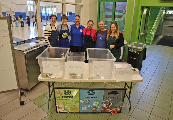 A group photo of UNH students in company of Child Nutrition Director Maredith St. Onge.