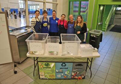A group photo of UNH students in company of Child Nutrition Director Maredith St. Onge.