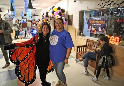 Principal Lowe and Mast Way PtO Chair Kelly Plouffe in the Mast Way lobby.