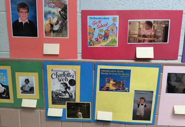 Picture of posters with book covers and baby pictures.