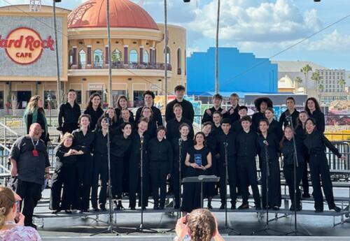 Oyster River High School students and teachers on stage during the Orlando concert.