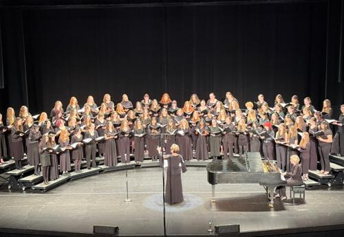 Choir students performing on stage during the 2026 All-State Music festival.