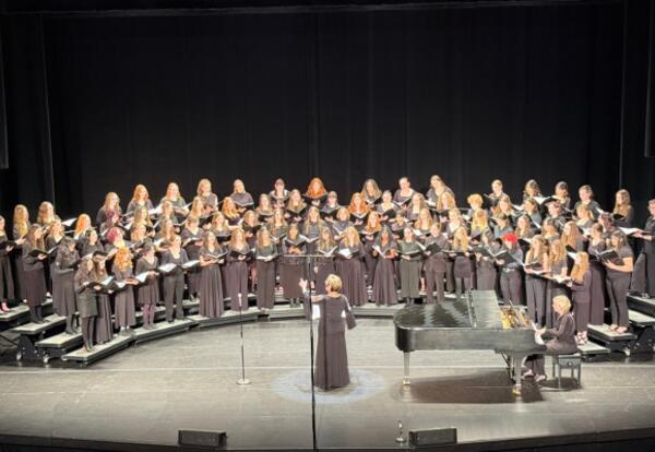 Choir students performing on stage during the 2026 All-State Music festival.
