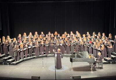 Choir students performing on stage during the 2026 All-State Music festival.