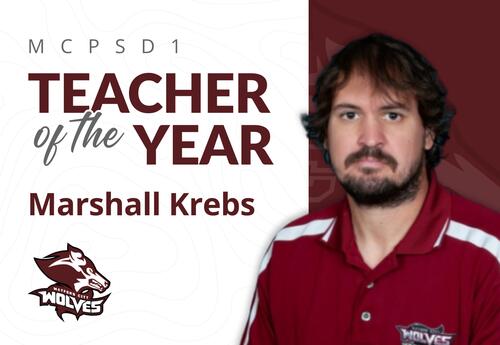 Announcing MCPSD1 Teacher of the Year, Marshall Krebs, featuring his portrait in a red Wolves polo and school logo.