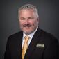 Professional photo of Mitch Lunde on a dark gray background.