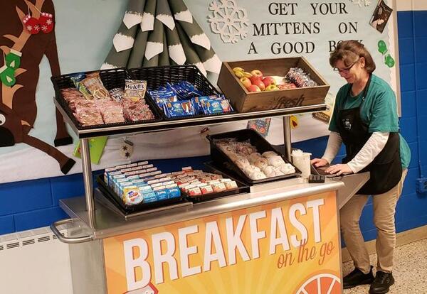 VVCS Teacher partaking in a breakfast cart