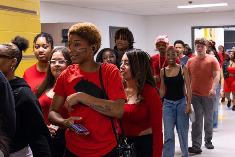SBEP seniors smile as they receive applause from their underclassmen. 