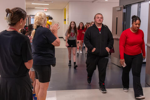 SBEP senior students receive applause as they walk through the hallways. 