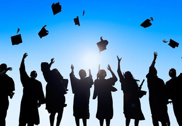Students throwing grad caps