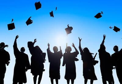 Students throwing grad caps