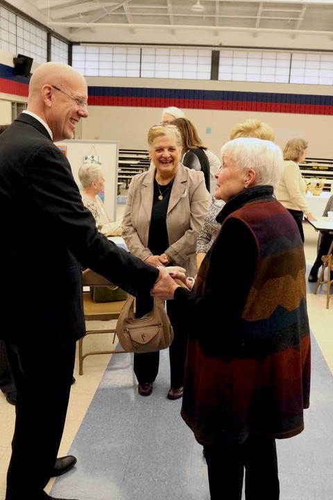 Dorothy Hendee, wife of former Superintendent the late Raymond Hendee, greets new Superintendent Eric Olson.