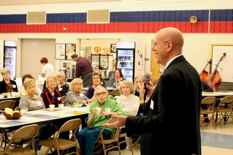 District 64 Superintendent Eric Olson speaks to retired employees