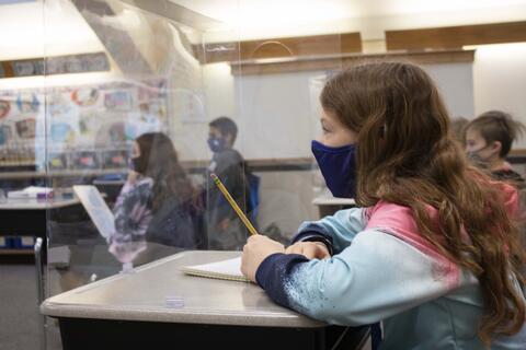 A Roosevelt fifth-grade student sits at her desk as in-person learning returns on Jan. 19.