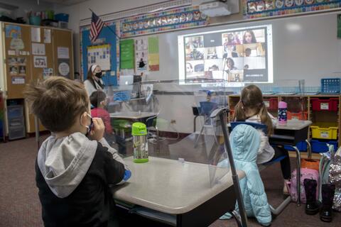 Roosevelt first-graders return to their classrooms and interact with their remote-learning counterparts on the first day back to in-person learning on Jan. 19.