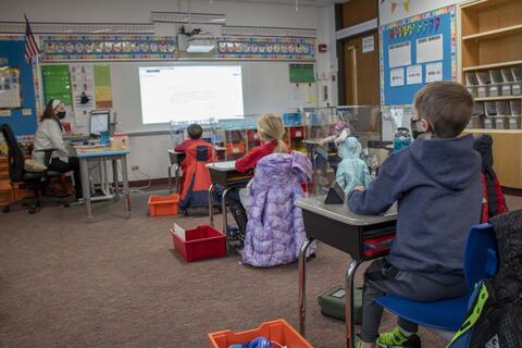 Roosevelt first-grade teacher Erika Tanaka teaches a group of students in her classroom along with remote-learning students as in-person returned on Jan. 19.