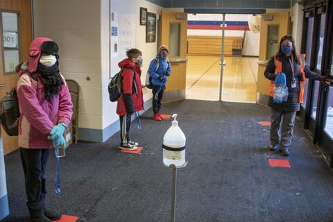 Emerson Middle School students wait to go to their homeroom as in-person learning returns on Jan. 20.