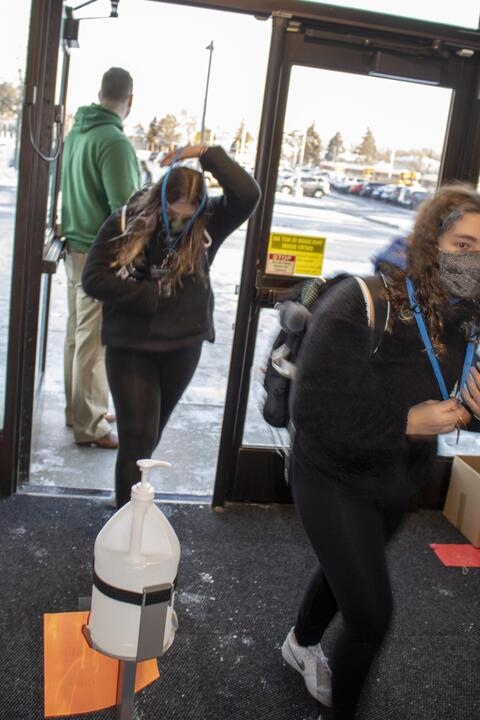 Emerson Middle School students don their health lanyards on the first day back to in-person learning on Jan. 20.