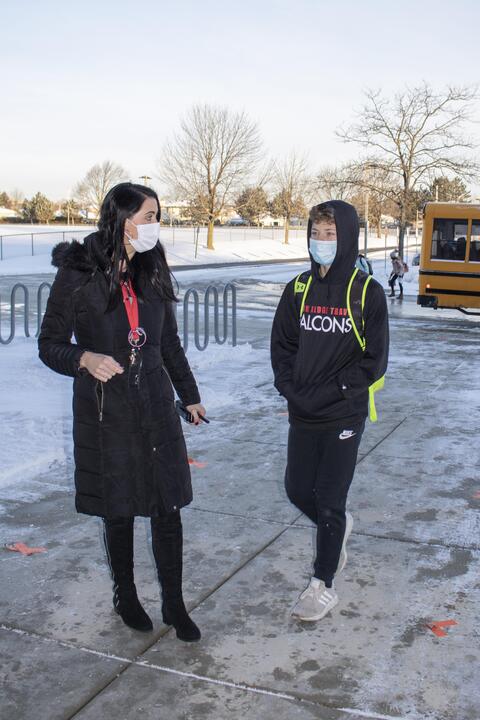 Emerson Middle School Principal Samantha Alaimo welcomes a student back to in-person learning on Jan. 20.