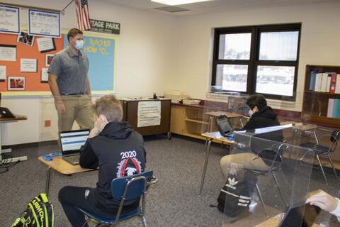 Emerson Middle School students open their computers as in-person learning returns on Jan. 20.