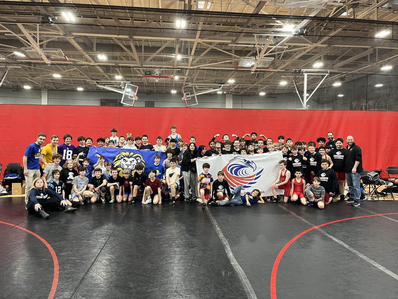 Local wrestling community gifts D64 athletes new uniforms | Park Ridge ...