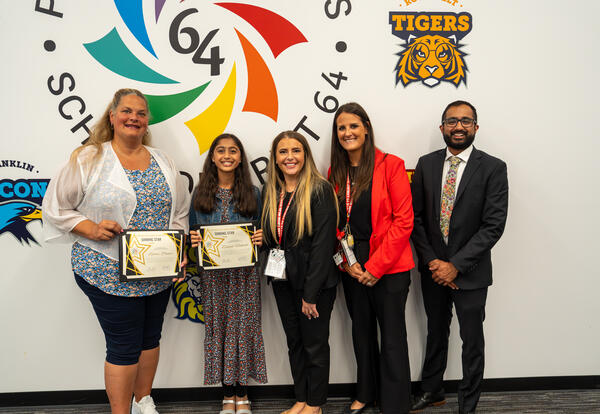 Emmy Pasier and Zainab Hakeem with their D64 Shining Star Awards