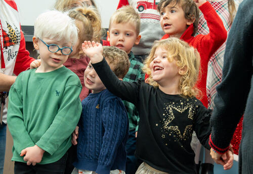 Students waving during the Jefferson Holiday Sing