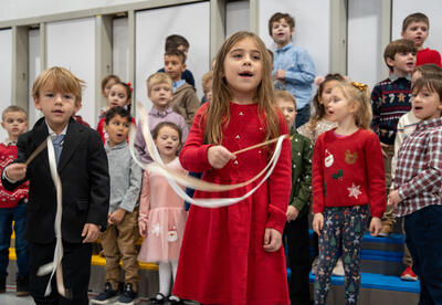 Roosevelt student twirls ribbon and sings