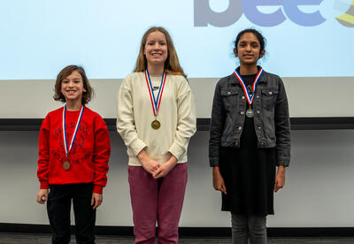 D64 Spelling Bee winner Abigail Matza with the 2nd and 3rd place finsihers Sarah Kurian and Mason Smith